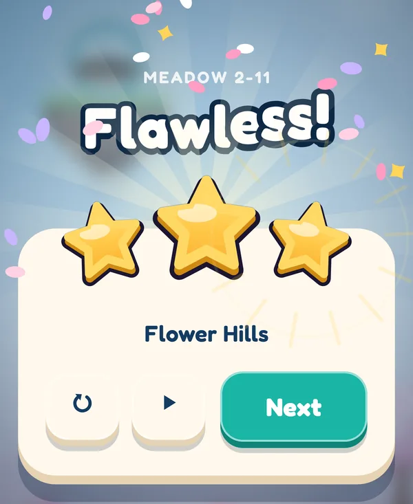 The win card for Flower Hills: Flawless! and three gold stars, with the Next button.